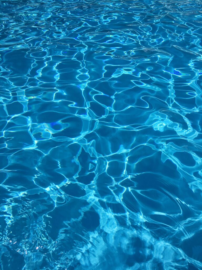 Rippling blue swimming pool water.